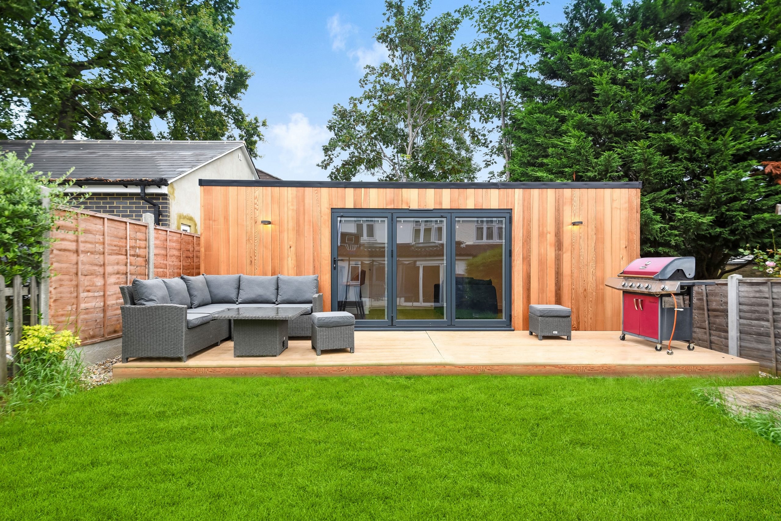 large garden room for entertaining with decking area