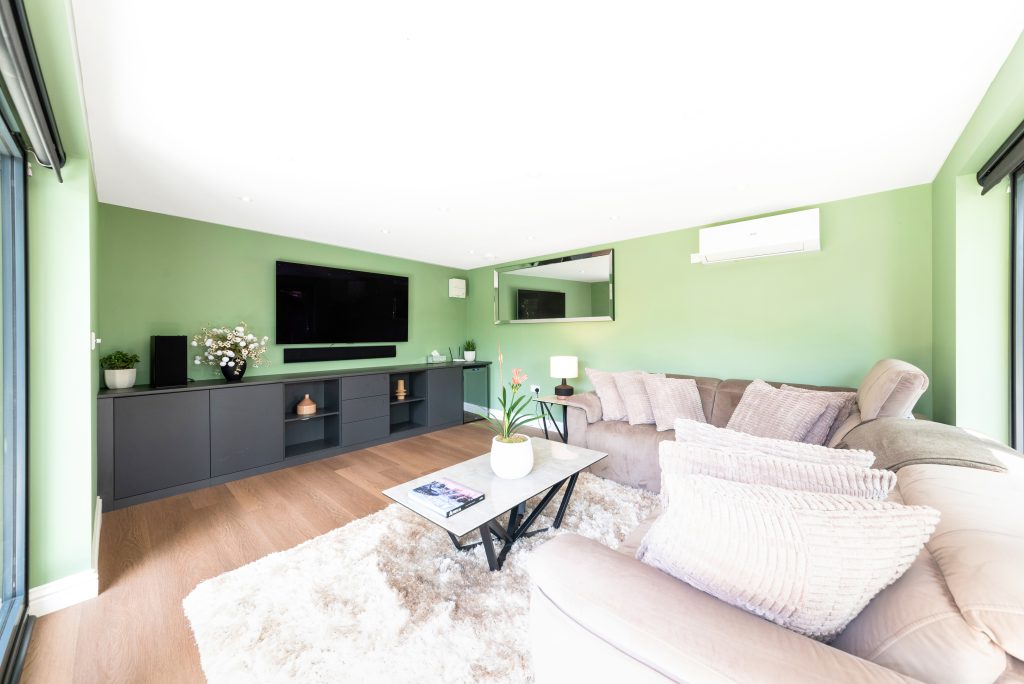 Modern garden room escape in West Byfleet with cedar cladding and full width bifold doors